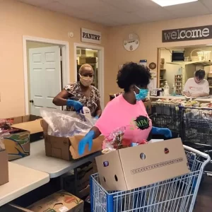 volunteers helping at the food pantry